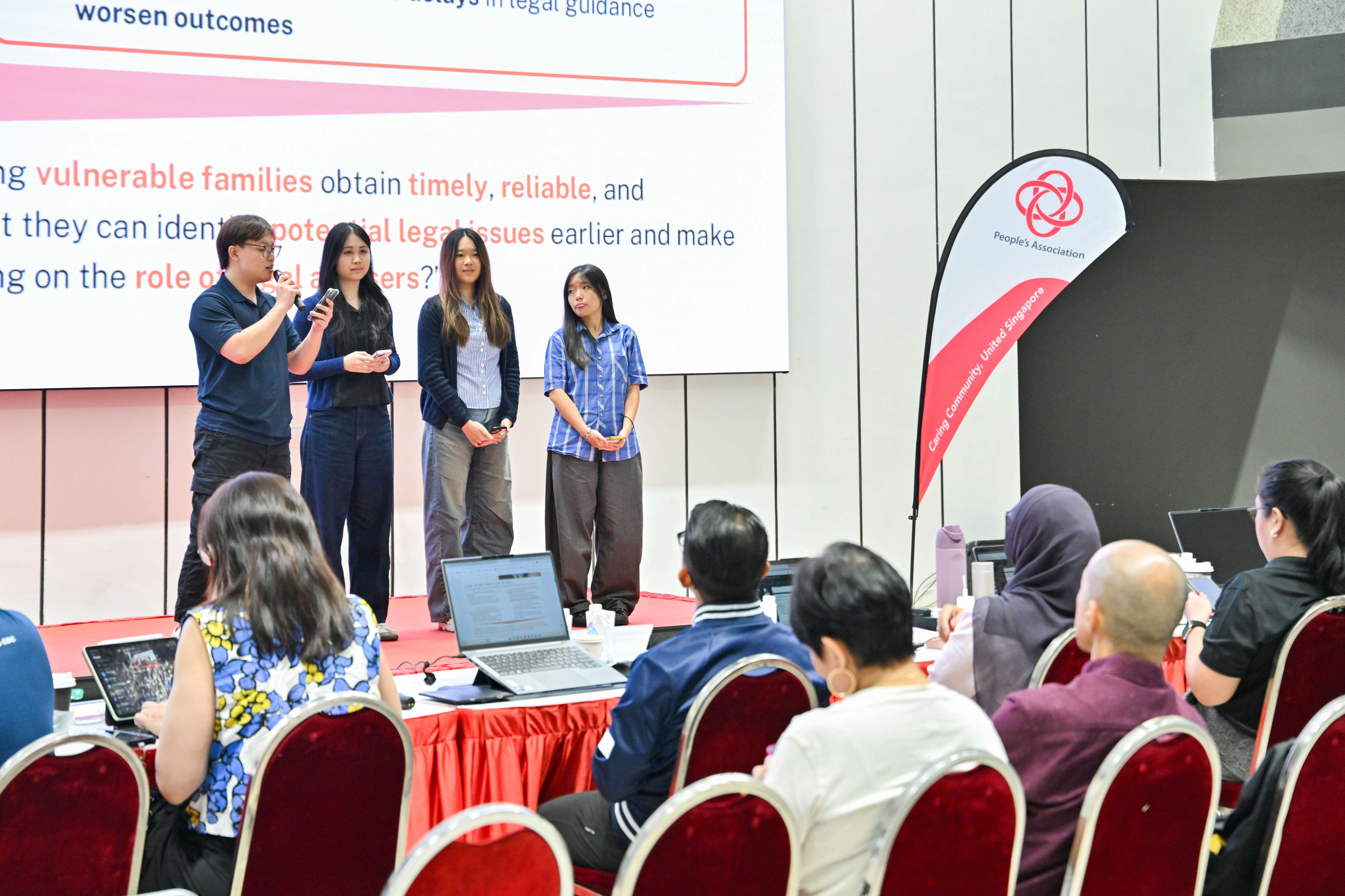 Four students explaining to the panel regarding vulnerable families